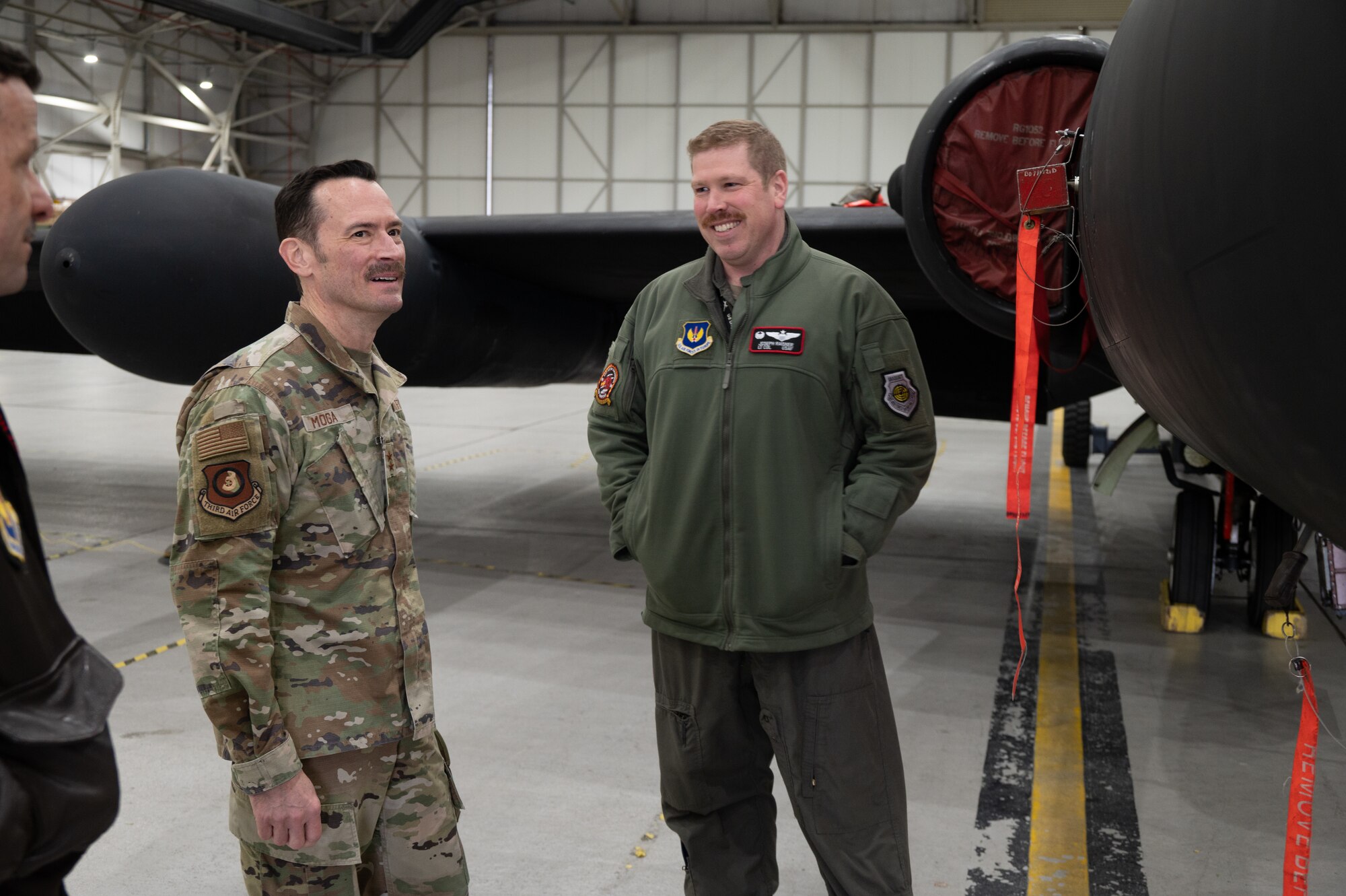 U.S. Air Force Maj. Gen. Paul Moga, Third Air Force commander, speaks with Lt. Col. Joseph J. Raisner