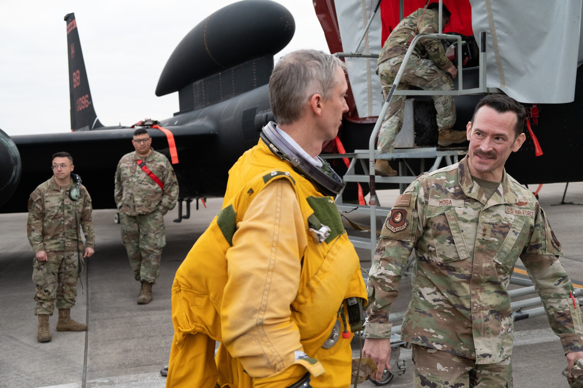 U.S. Air Force Maj. Gen. Paul Moga, Third Air Force commander, speaks with a 99th Expeditionary Reconnaissance Squadron