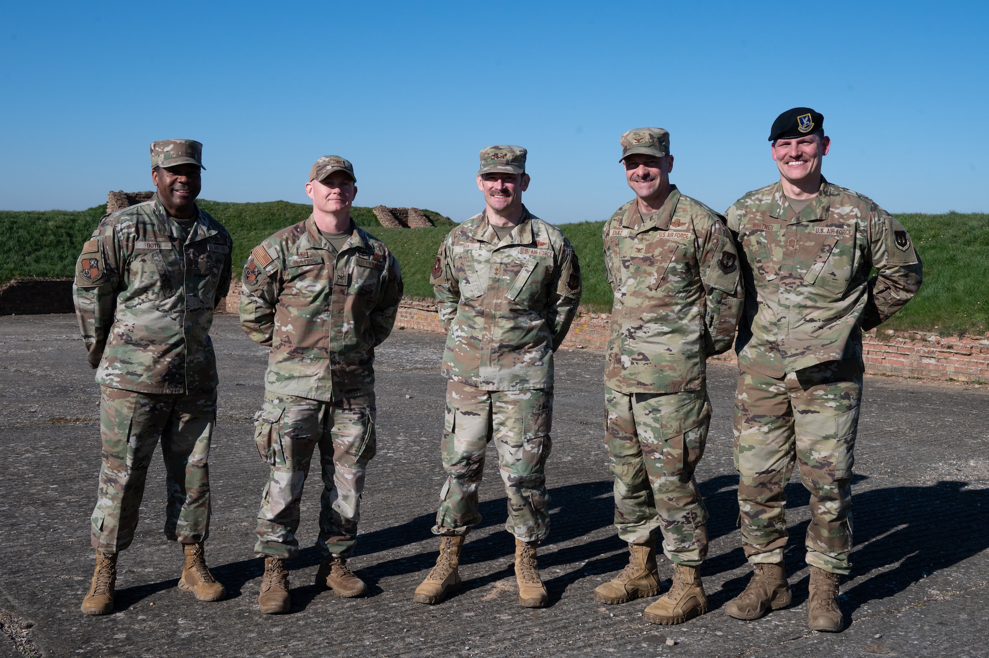 U.S. Air Force Maj. Gen. Paul Moga, Third Air Force commander, poses with leaders from the 501st Combat Support Wing
