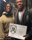 Maj. Chris Wright is pictured with his son, Isaiah, on the day of his promotion to Brazilian Jiu-Jitsu black belt on Dec. 8, 2024.
