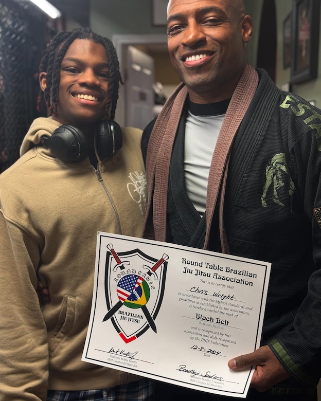 Maj. Chris Wright is pictured with his son, Isaiah, on the day of his promotion to Brazilian Jiu-Jitsu black belt on Dec. 8, 2024.