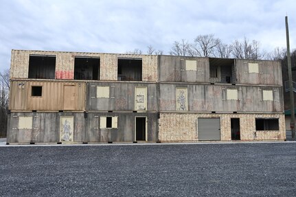 A new sniper tower is being added to a sniper range at Fort Indiantown Gap, Pa. The tower, which is built out of shipping containers that have been welded together and shaped into rooms with different dimensions and configurations is 3 stories high and approximately 100 feet wide. (Pennsylvania National Guard photo by Brad Rhen)