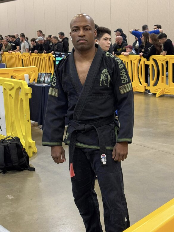 Maj. Chris Wright, an operations officer with U.S. Army Medical Logistics Command, is pictured between matches at his first ever International Brazilian Jiu-Jitsu Federation event in Fredericksburg, Va. Wright, who was promoted to black belt in December 2024, finished in third place in his division at the event.