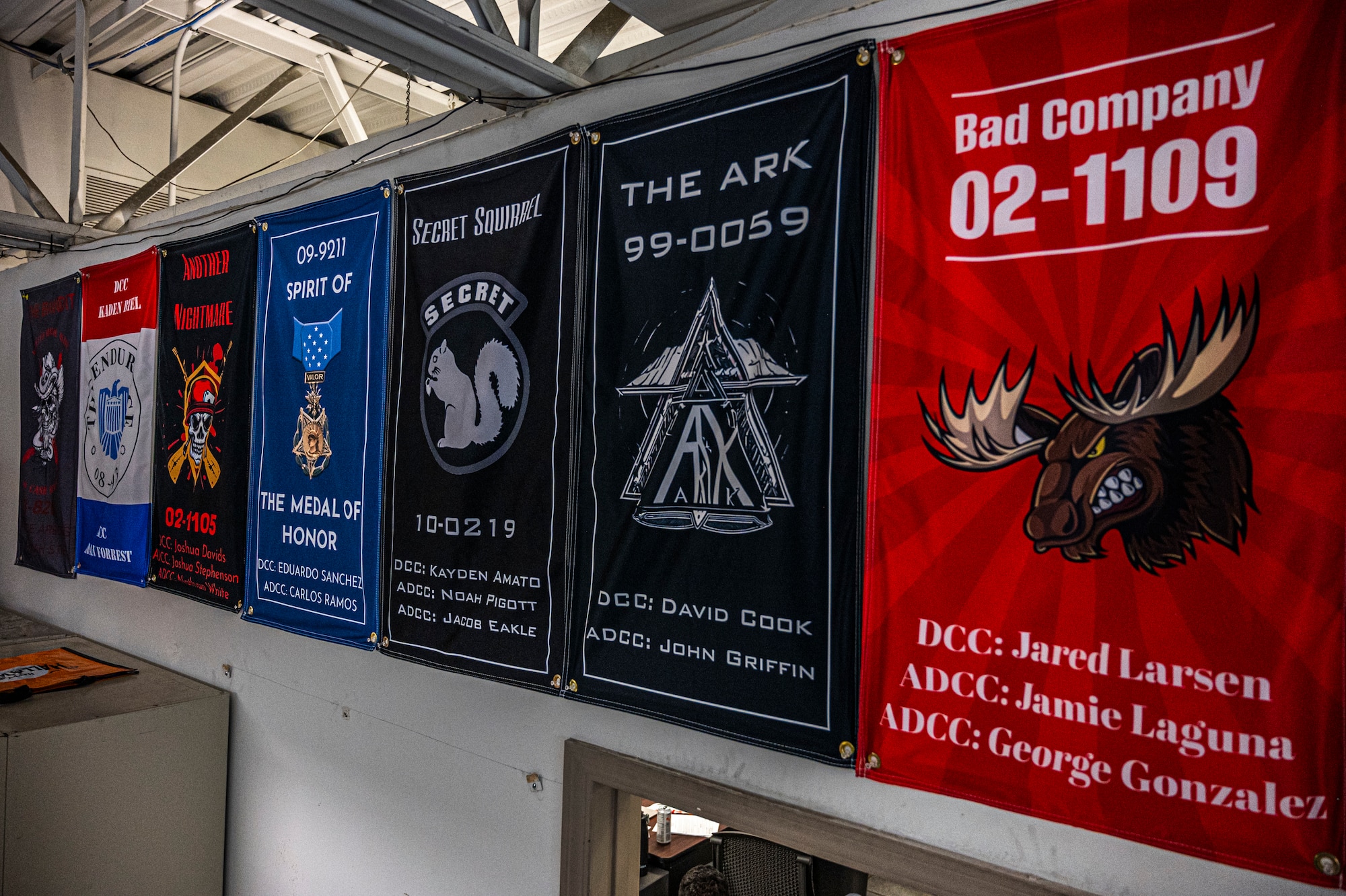 Banners representing different 62d Airlift Wing C-17 Globemaster III’s, and showing their dedicated and assistant dedicated crew chiefs, hang in the 62d Aircraft Maintenance Squadron’s Silver Aircraft Maintenance Unit shop at Joint Base Lewis-McChord, Washington, March 26, 2025.
