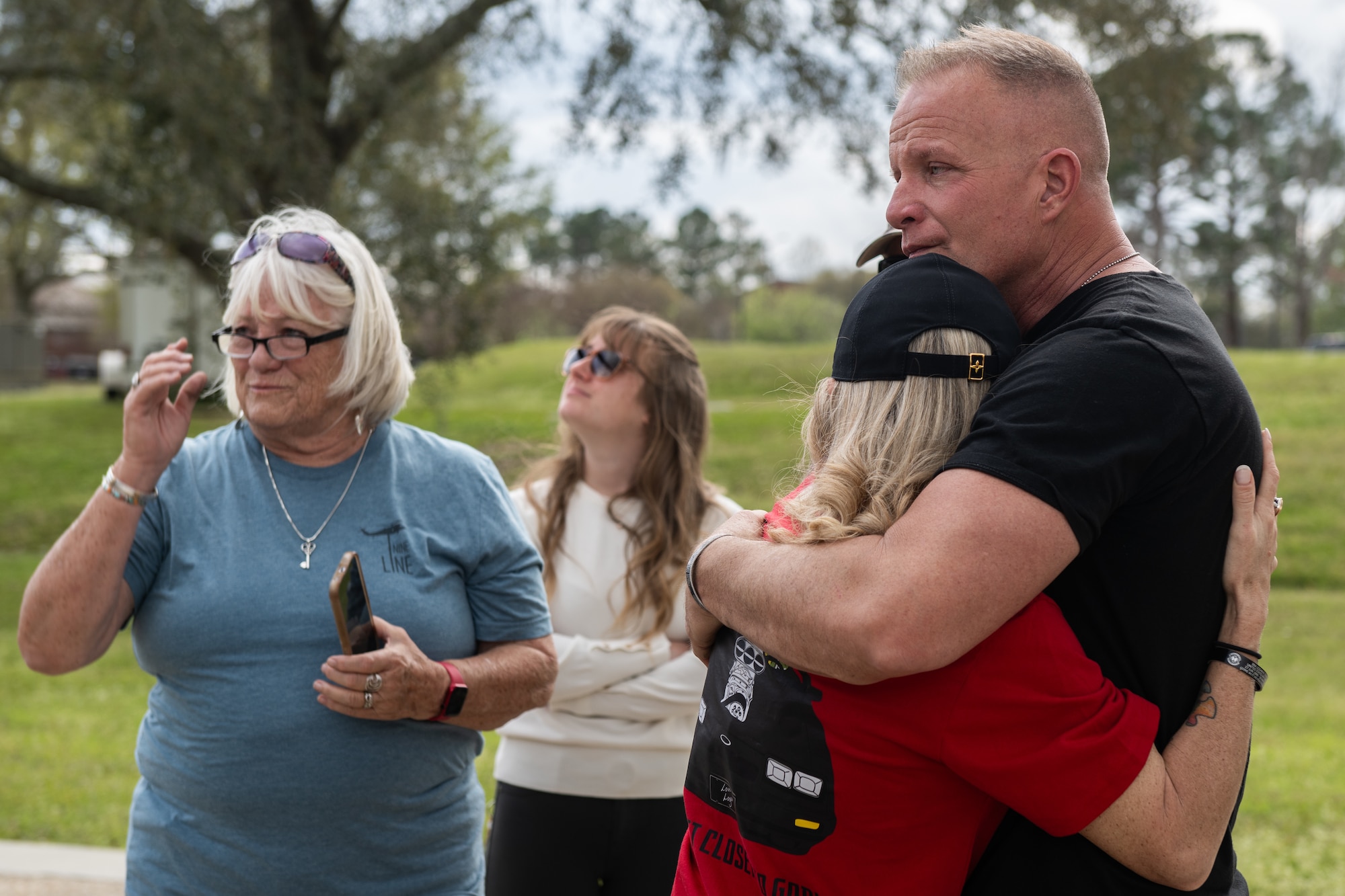 A man embraces his wife.