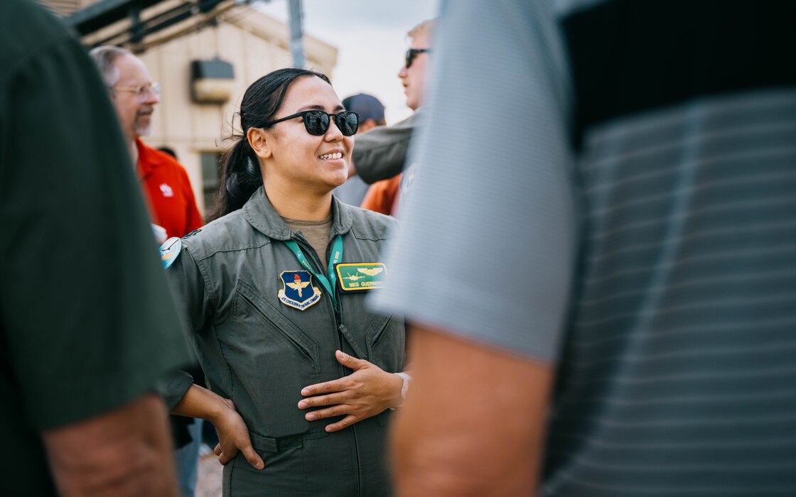 U.S. Air Force Capt. Meg Guerro, 310th Fighter Squadron F-35A Lightning II student pilot, speaks to community leaders.