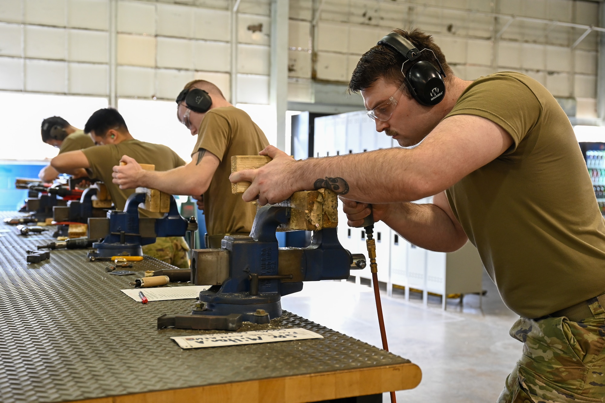 Soldiers practice woodworking.