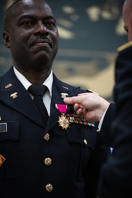 Chief Warrant Officer 5 Melvin J. Murphy receives the Legion of Merit from Col. Eric W. Frazier, chief of staff for logistics, during Murphy’s retirement ceremony held at the Norman Armed Forces Reserve Center in Norman, Oklahoma, Mar. 20, 2025. Murphy, a full-time Soldier with the OKARNG, was recognized for his outstanding career spanning 39-years in the military as an expert logistician. (Oklahoma National Guard photo by Spc. Anthony Ackah-Mensah)