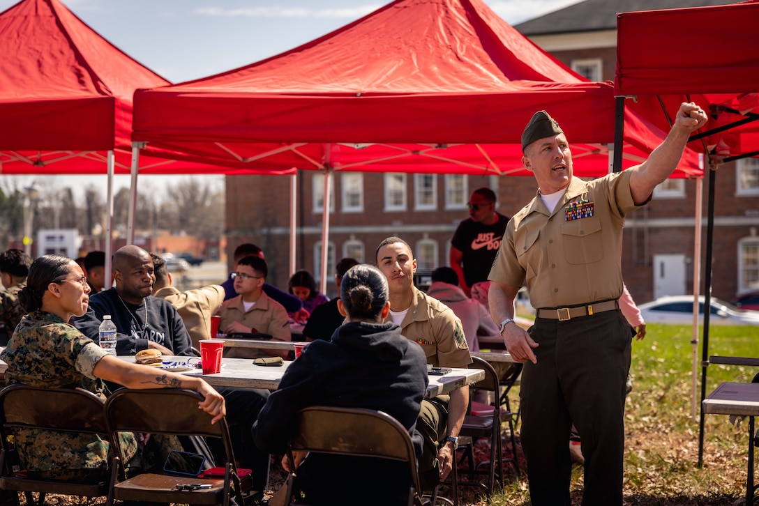 U.S. Marine Corps Sgt. Maj. Robert McLain, sergeant major of Security Battalion, right, speaks with Marines during a Burger Burn on Marine Corps Base Quantico, Virginia, March 28, 2025. The Burger Burn took place to help build comradery and better the relations amongst the Marines in the battalion. (U.S. Marine Corps photo by Cpl. Joaquin Dela Torre)