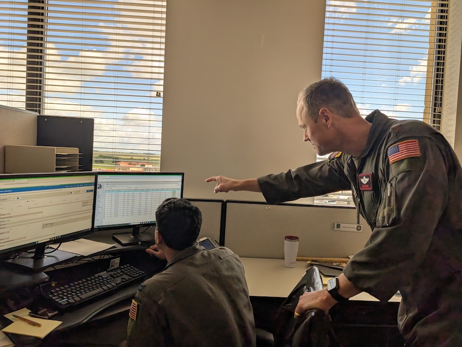 Man points at monitor