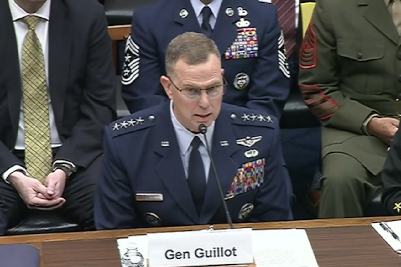 A man speaks into a microphone.
