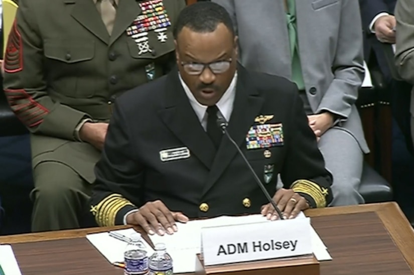 A man speaks into a microphone.