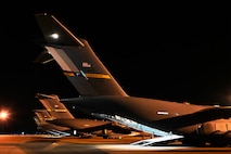 A photo of several jets on a flightline ramp.