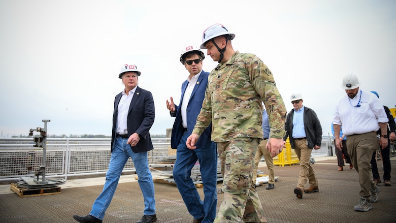 Lt. Col. Robert Green (right), commander of the Nashville District U.S. Army Corps of Engineers, walks with Rep. Dale Strong (middle) of Alabama's 5th Congressional District and Rep. Mike Collins (left) of Georgia's 10th Congressional District during a tour of Wilson Lock in Florence, Alabama, on March 28, 2025. (USACE Photo by Noe Gonzalez)