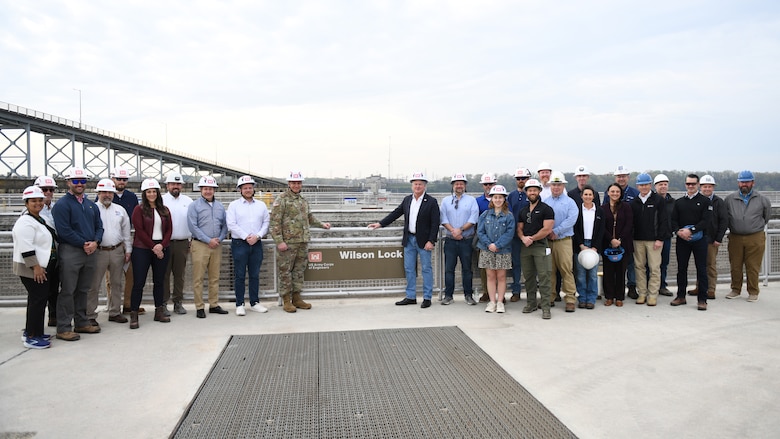 U.S. Army Corps of Engineers Nashville District and Tennessee Valley Authority officials pose with Rep. Mike Collins of Georgia’s 10th Congressional District and staffers during a tour March 28, 2025, at Wilson Lock in Florence, Alabama. The tour provided a firsthand look at ongoing efforts to repair the main navigation lock. (USACE Photo by Noe Gonzalez)