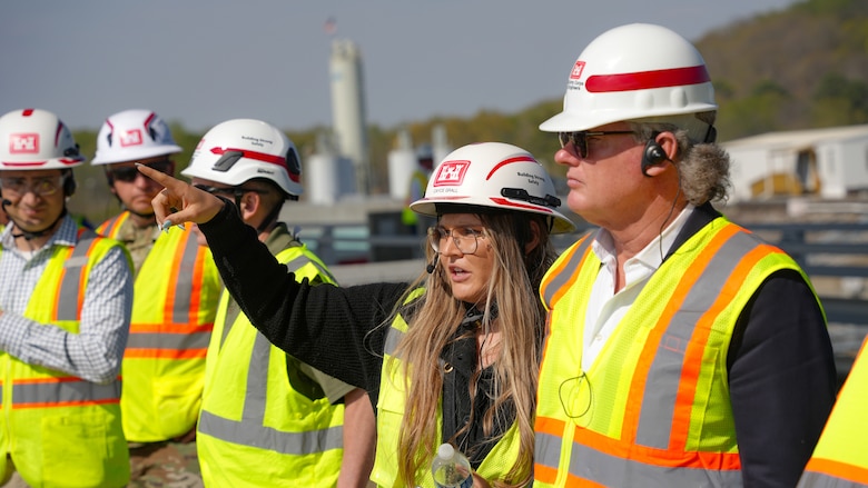 Cayce Grall, project manager with the U.S. Army Corps of Engineers Nashville District, points out features of the Chickamauga Lock Replacement Project to Rep. Mike Collins, Georgia Congressional District 10, chairman of the House Subcommittee on Water Resources and Environment, during a tour of the project in Chattanooga, Tennessee, March 28, 2025. The subcommittee has jurisdiction over USACE’s Civil Works program through developing the biannual Water Resources Development Act, which shapes the policies and programs that govern Corps missions in flood risk management, navigation, and more. (USACE Photo by Jeremy Croft)
