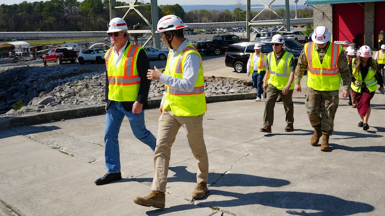 Joe Cotton, project manager with the U.S. Army Corps of Engineers Nashville District, walks with Rep. Mike Collins, Georgia 10th District, chairman of the House Subcommittee on Water Resources and Environment, while describing the Chickamauga Lock Replacement Project in Chattanooga, Tennessee during a tour of the project March 28, 2025. The new lock at Chickamauga will feature a 110-foot by 600-foot chamber that will accommodate nine jumbo barges, greatly speeding up transit time. (USACE Photo by Jeremy Croft)