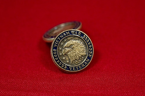 A Vietnam War veteran memorial pin rests on a display table during a ceremony at Little Rock Air Force Base, Arkansas, March 29, 2025. National Vietnam War Veterans Day, established in 2017, is observed annually on March 29 to honor the men and women who served during one of the most complex and challenging periods in American military history.