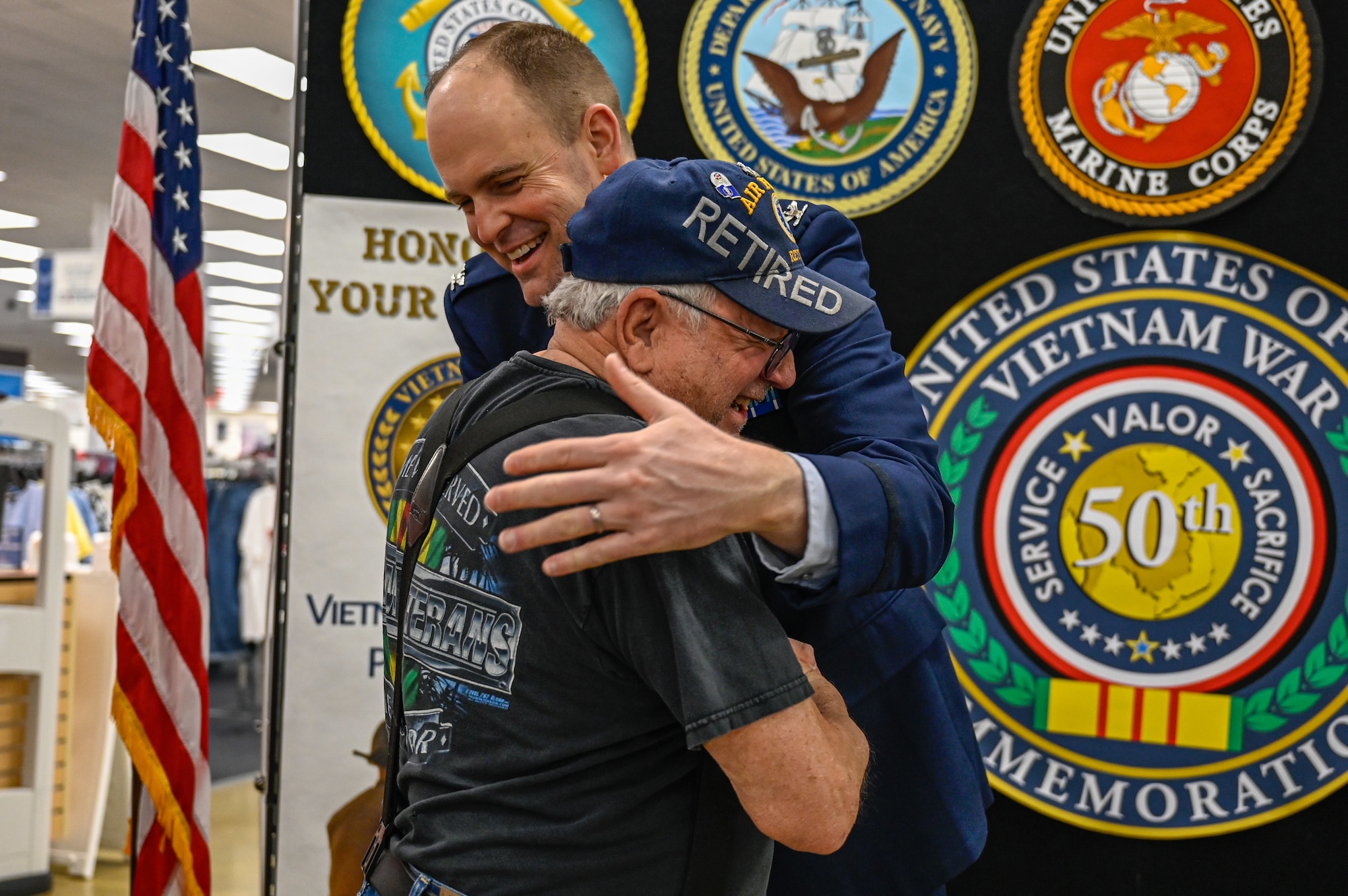 A Vietnam War veteran hugs U.S. Air Force Col. Denny Davies, 19th Airlift Wing and installation commander, after receiving a commemorative lapel pin during a ceremony at Little Rock Air Force Base, Arkansas, March 29, 2025. National Vietnam War Veterans Day, established in 2017, is observed annually on March 29 to honor the men and women who served during one of the most complex and challenging periods in American military history.