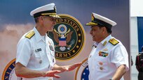 VISAKHAPATNAM, Andhra Pradesh, India (April 1, 2025) - Rear Adm. Greg Newkirk, Commander, Task Force (CTF) 70, greets Indian Navy (IN) Vice Adm. Sameer Saxena, Chief of Staff, Eastern Naval Command, on the flight deck aboard the IN amphibious transport dock INS Jalashwa (L41) during the opening ceremony of Exercise Tiger Triumph 2025, at the Naval Dockyard, Visakhapatnam, Andhra Pradesh, India, April 1. Tiger Triumph is a joint and combined U.S.-India exercise focused on humanitarian assistance and disaster relief readiness and interoperability. Tiger Triumph enables U.S. and Indian armed forces to improve interoperability and bilateral, joint, and service readiness in the Indian Ocean region and beyond to support a free and open Indo-Pacific. (U.S. Navy photo by Mass Communication Specialist 1st Class Caroline H. Lui)