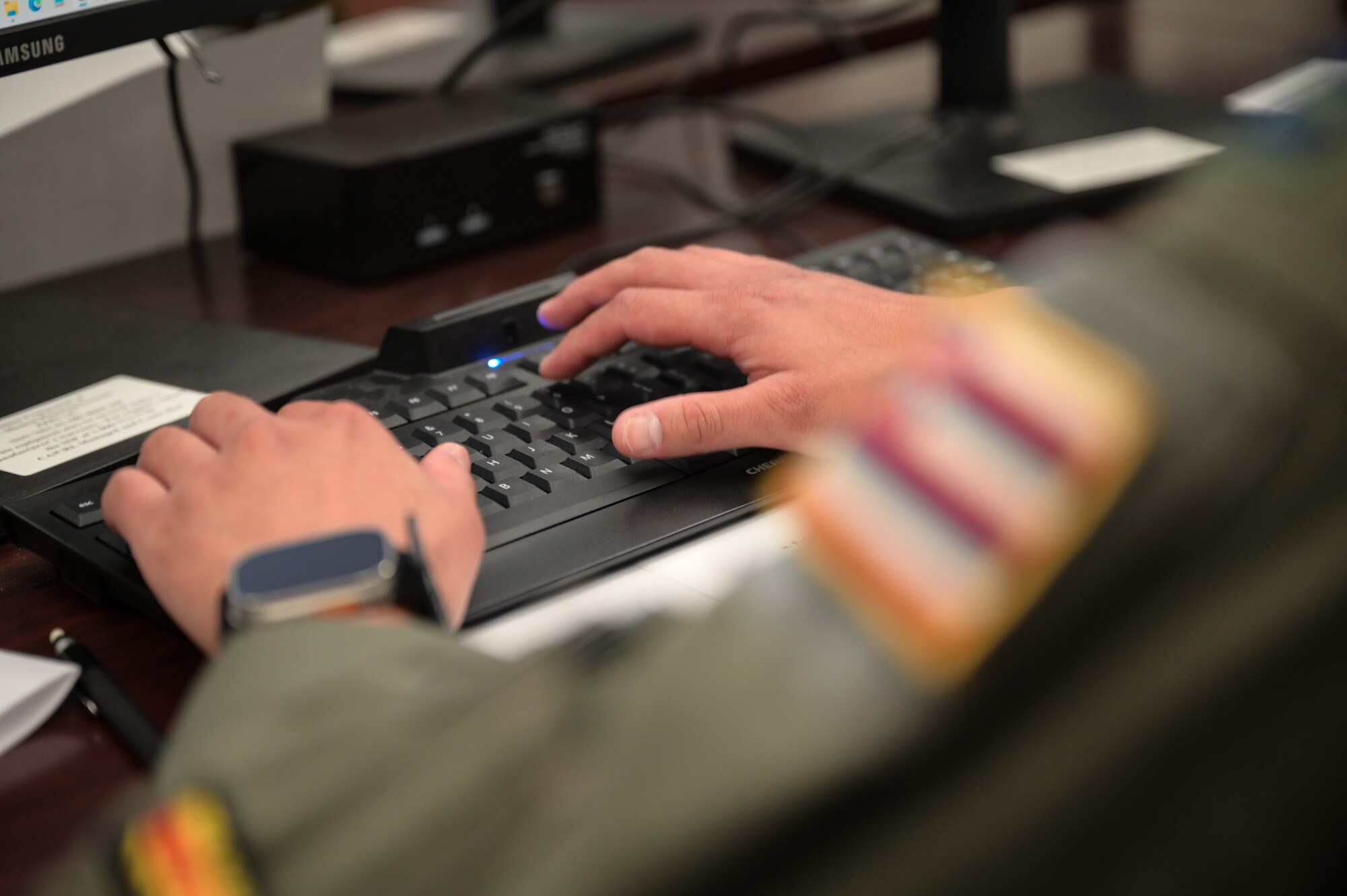 Airman types on a keyboard.