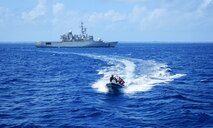 On March 22, 2025, the USCGC Frederick Hatch (WPC 1143) boarding team return from the Prairial aboard the French small boat following a simulated Western and Central Pacific Fisheries Commission (WCPFC) inspection and tabletop discussion on illegal, unreported, and unregulated fishing (IUUF) meeting international security objectives with a key partner in the region.