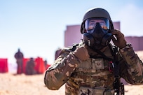 Airman wearing gas mask
