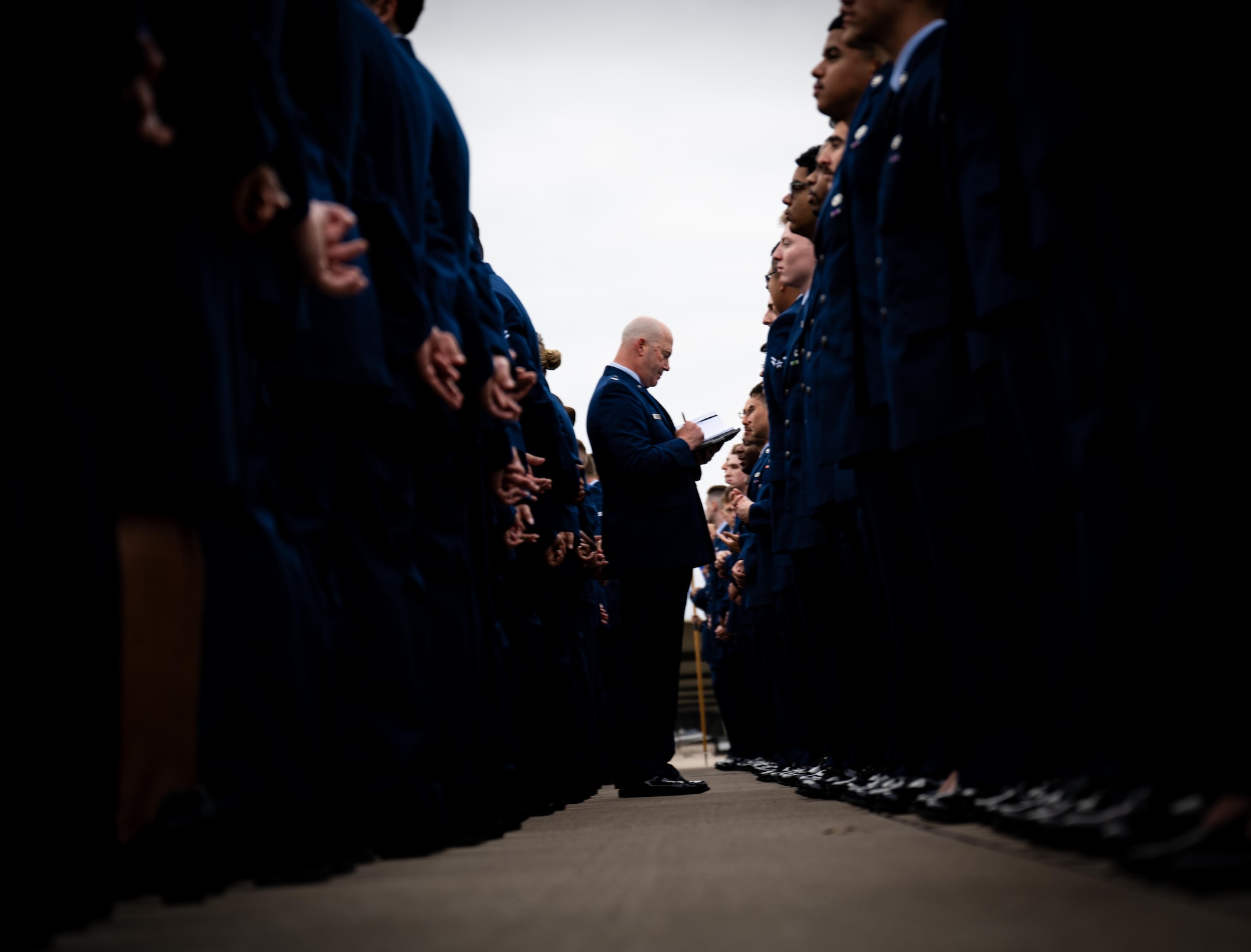 U.S. Air Force Lt. Col. Michael Vastola, 47th Operations Support Squadron, director of operations, inspects Airmens’ blues at Laughlin Air Force Base on March 28, 2025. 1,200 total force Airmen lined up on the flightline for their standards and readiness review blues inspection. (U.S. Air Force photo by Airman 1st Class Harrison Sullivan)