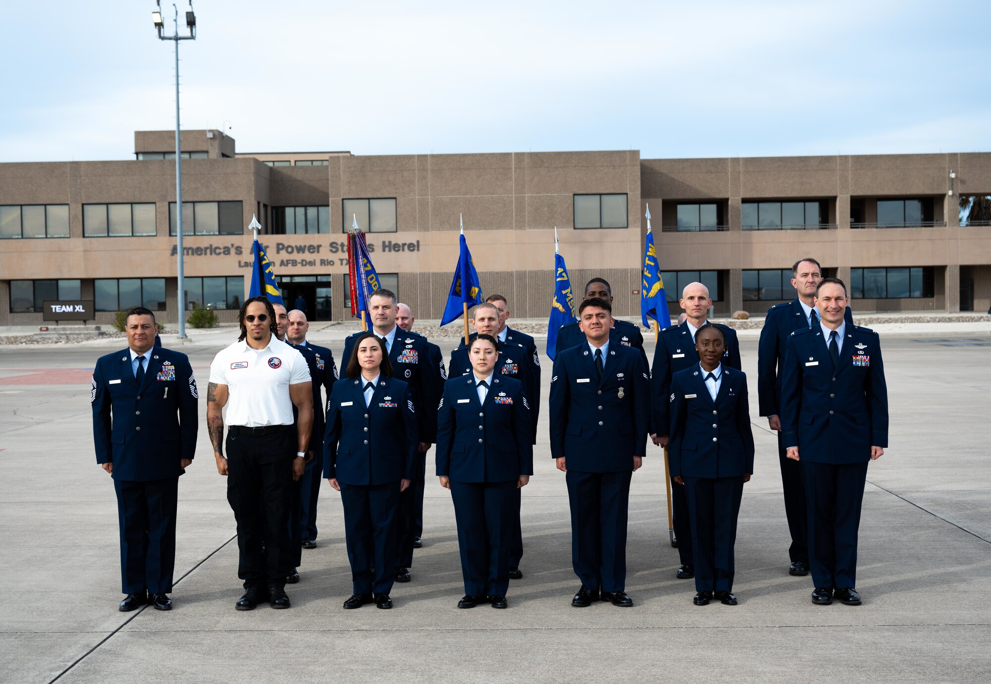 U.S. Air Force Airmen stand at position of attention at Laughlin Air Force Base on March 28, 2025. Five total force Airmen were picked to represent their respective group for the best in dress and appearance. (U.S. Air Force photo by Airman 1st Class Harrison Sullivan)