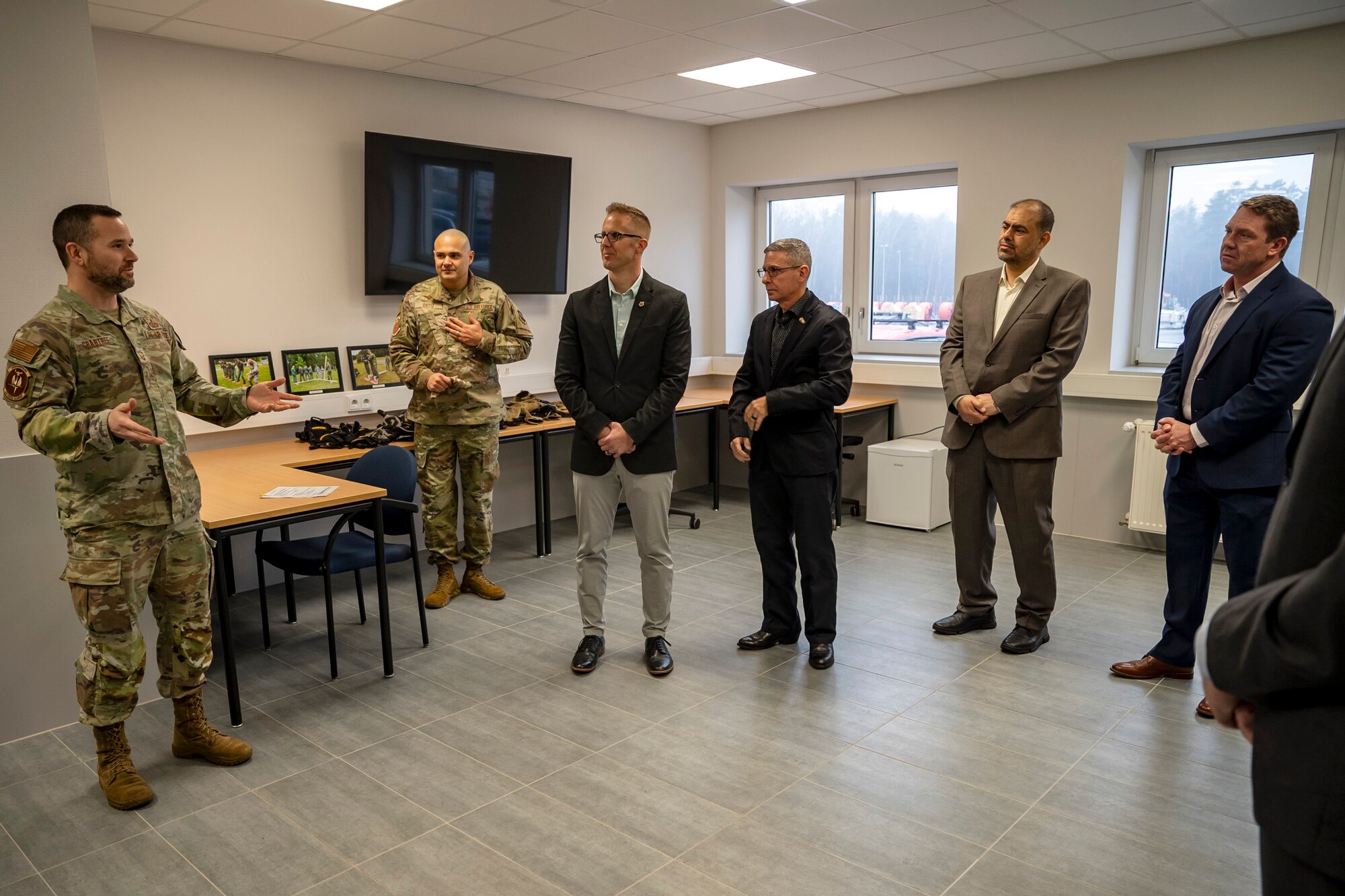 U.S. Air Force Senior Master Sgt. Craig Crabtree, Inter-European Air Forces Academy (IEAFA) joint operations superintendent, briefs participants of the Air Forces Central Chiefs Summit during a tour of the IEAFA facility at Kapaun Air Station, Germany, Feb. 12, 2025.
