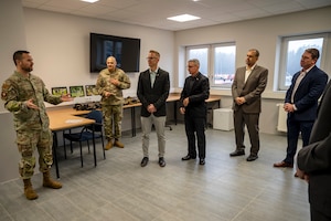 U.S. Air Force Senior Master Sgt. Craig Crabtree, Inter-European Air Forces Academy (IEAFA) joint operations superintendent, briefs participants of the Air Forces Central Chiefs Summit during a tour of the IEAFA facility at Kapaun Air Station, Germany, Feb. 12, 2025.