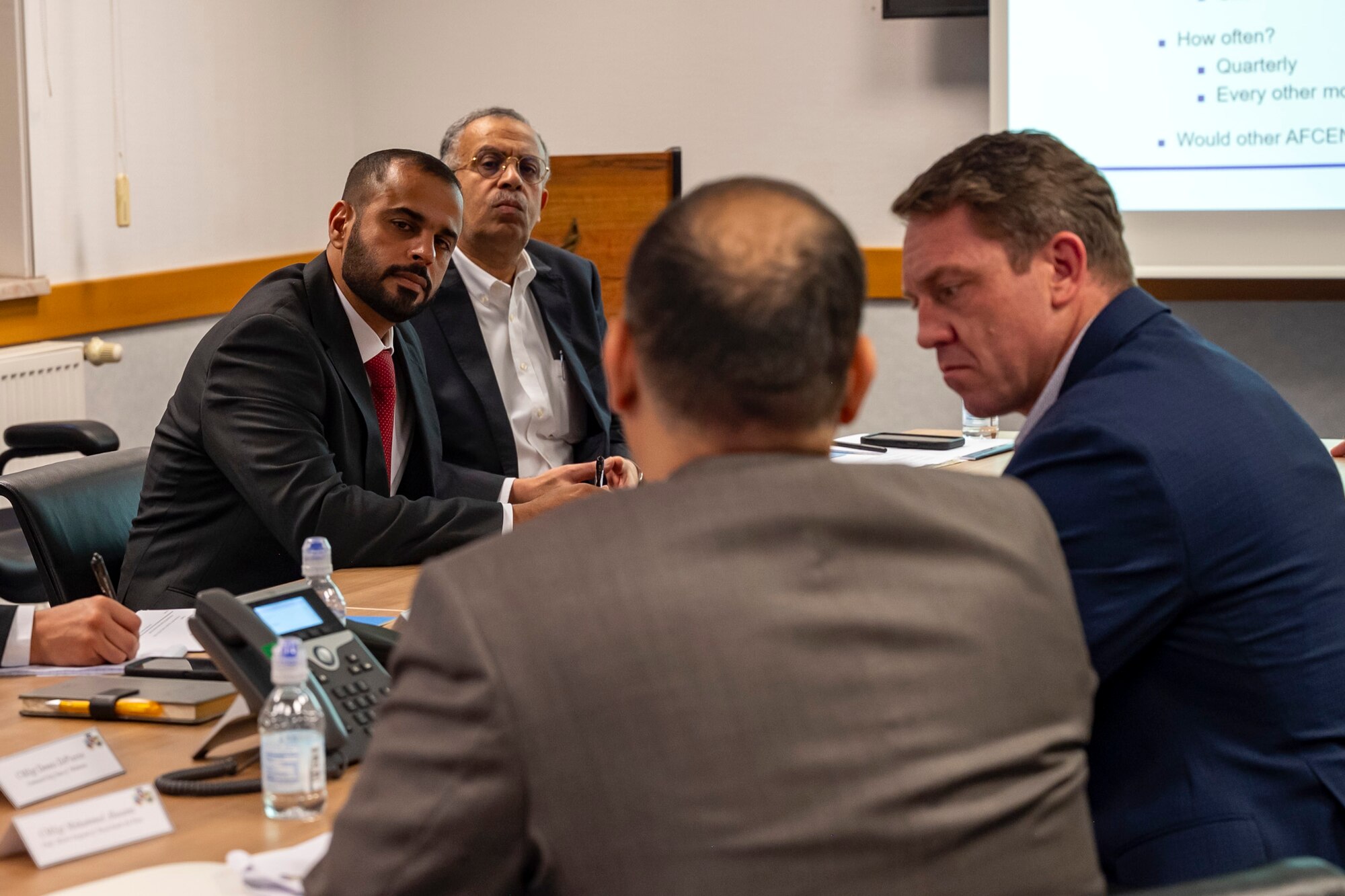 United Arab Emirates Air Forces and Air Defense Senior Warrant Officer Ibrahim Al Naqbi, left, and Atef Wahba, Cultural Advisor to the Commander, Ninth Air Force (Air Forces Central), participate in a discussion on the future of international professional military education (PME) in the U.S. Central Command (CENTCOM) area of responsibility with participants of the Air Forces Central Chiefs Summit at Ramstein Air Base, Germany, Feb. 12, 2025.