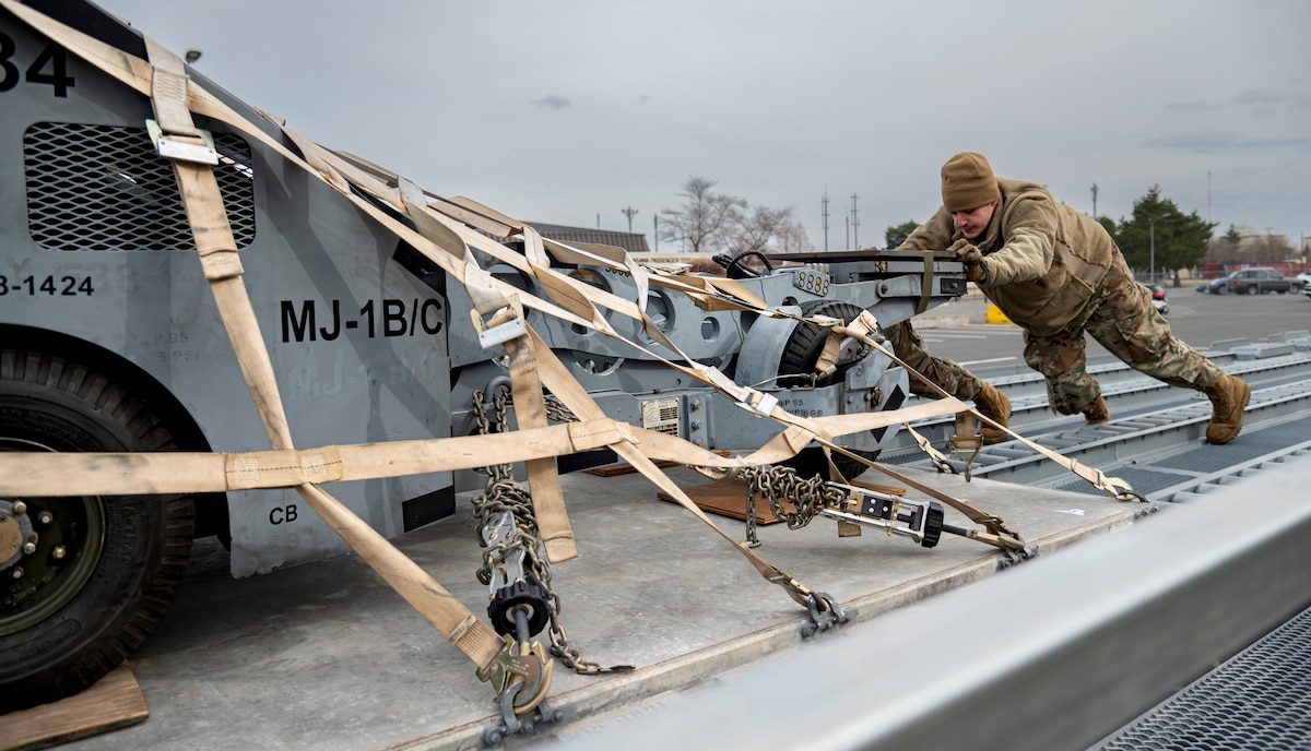 U.S. Air Force Airman 1st Class Daniel Archer, 35th Maintenance Squadron conventional munitions crew chief, moves cargo in preparation of Balikatan 25 at Misawa Air Base, Japan, April 1, 2025. The 35th Logistics Readiness Squadron provides critical logistical support, keeping the 35th Fighter Wing postured for agile operations in the Indo-Pacific theater. (U.S. Air Force photo by Senior Airman Brittany Russell)