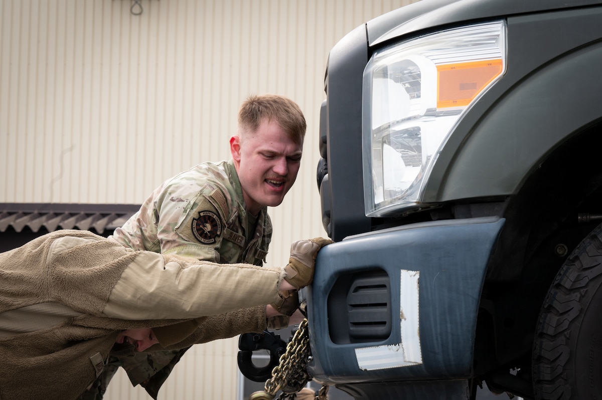 U.S. Air Force Airman 1st Class Jack Shaver, right, 35th Maintenance Squadron (MXS) stockpile management technician, and Airman 1st Class Daniel Archer, 35th MXS conventional munitions crew chief, move cargo in preparation of Balikatan 25 at Misawa Air Base, Japan, April 1, 2025. The 35th Logistics Readiness Squadron provides critical logistical support, keeping the 35th Fighter Wing postured for agile operations in the Indo-Pacific theater. (U.S. Air Force photo by Kohei Sugisawa)
