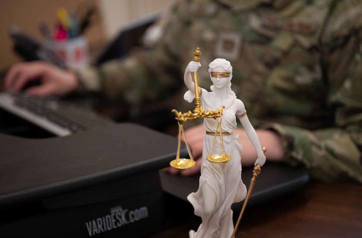 lady justice sits on the desk