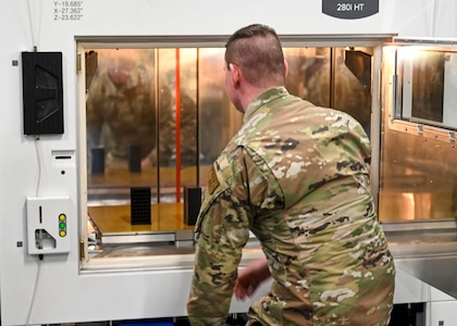 Staff Sgt. Ryan Krasnecky, 104th Fighter Wing metals technology journeyman, examines a 3D-printed ammo container, January 15, 2025, at Barnes Air National Guard Base, Westfield, Mass.