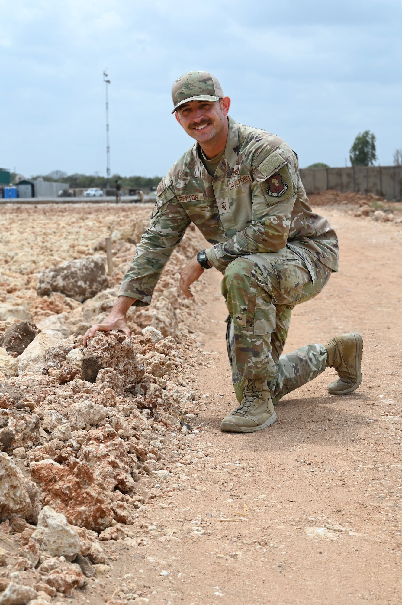 U.S. Air Force Master Sgt. Scott Peyton,  475th Civil Engineer Flight  superintendent at Camp Simba, Manda Bay, Kenya, poses for a photo on Jan. 29, 2025. The joint-service engineer force at Camp Simba has been integral to the plans and preparations ahead of the Department of Defense and Department of State expansion of the strategic operating location, including 294,000 square feet of airfield construction and increased fuel storage capacity. Enduring infrastructure is vital to enhancing interoperability and will enable Kenya's continued growth as a strategic military partner, with the capacity to maintain security in the region against threats like Al-Shabaab. (U.S. Air Force photo by Master Sgt. Kayla White)