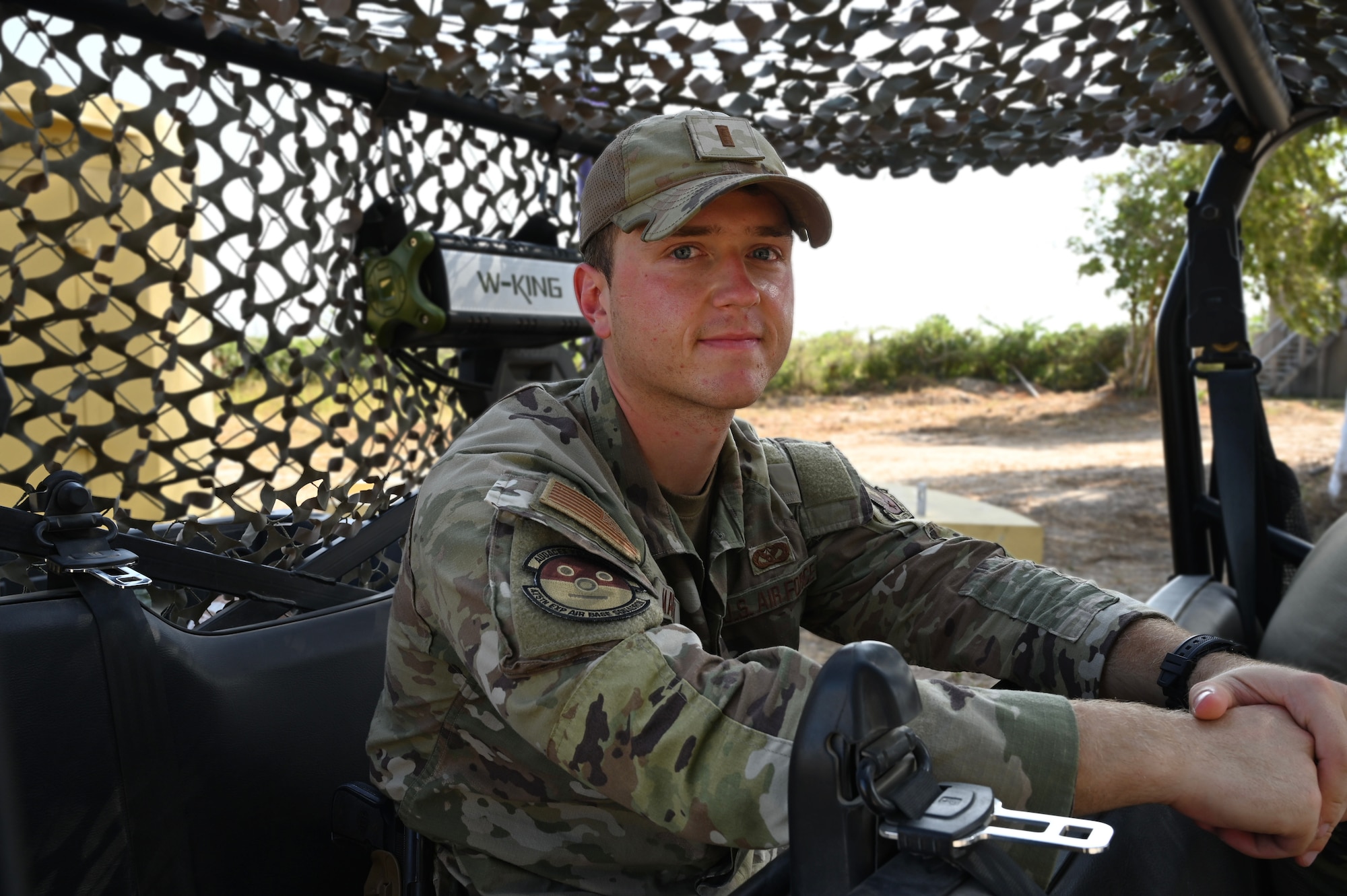U.S. Air Force 2nd Lt. Michael Martin,  475th Civil Engineer Flight  commander at Camp Simba, Manda Bay, Kenya, poses for a photo on Jan. 29, 2025. The joint-service engineer force at Camp Simba has been integral to the plans and preparations ahead of the Department of Defense and Department of State expansion of the strategic operating location, including 294,000 square feet of airfield construction and increased fuel storage capacity. Enduring infrastructure is vital to enhancing interoperability and will enable Kenya's continued growth as a strategic military partner, with the capacity to maintain security in the region against threats like Al-Shabaab. (U.S. Air Force photo by Master Sgt. Kayla White)