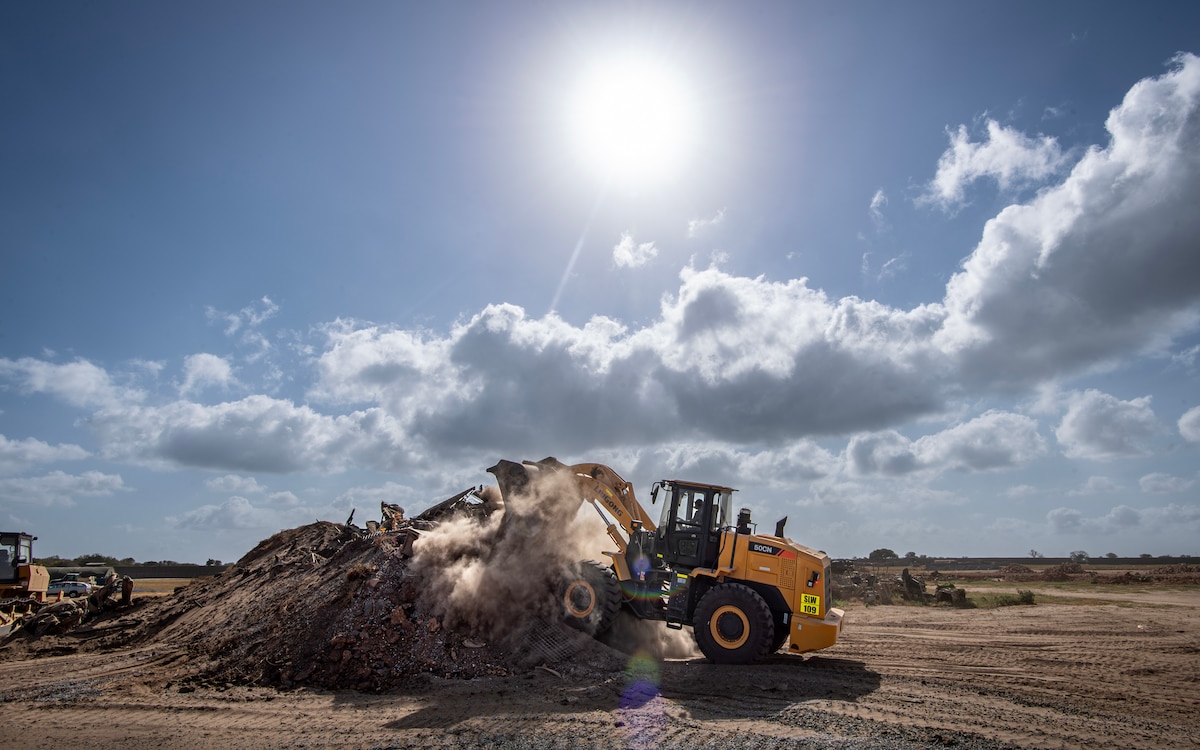 A member of the 475th Civil Engineer Flight at Camp Simba, Manda Bay, Kenya, operates a front loader on Jan. 15, 2025. The joint-service engineer force at Camp Simba has been integral to the plans and preparations ahead of the Department of Defense and Department of State expansion of the strategic operating location, including 294,000 square feet of airfield construction and increased fuel storage capacity. Enduring infrastructure is vital to enhancing interoperability and will enable Kenya's continued growth as a strategic military partner, with the capacity to maintain security in the region against threats like Al-Shabaab. (U.S. Air Force photo by Tech. Sgt. Jana Somero)