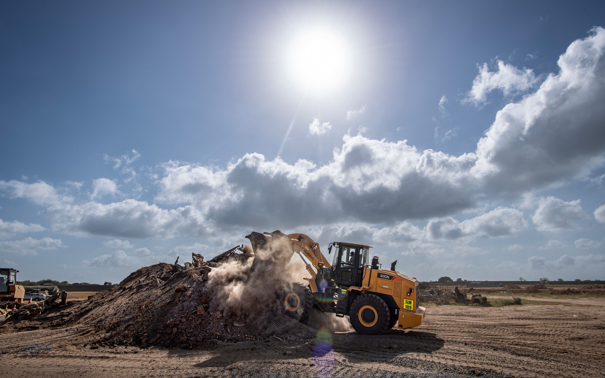 A member of the 475th Civil Engineer Flight at Camp Simba, Manda Bay, Kenya, operates a front loader on Jan. 15, 2025. The joint-service engineer force at Camp Simba has been integral to the plans and preparations ahead of the Department of Defense and Department of State expansion of the strategic operating location, including 294,000 square feet of airfield construction and increased fuel storage capacity. Enduring infrastructure is vital to enhancing interoperability and will enable Kenya's continued growth as a strategic military partner, with the capacity to maintain security in the region against threats like Al-Shabaab. (U.S. Air Force photo by Tech. Sgt. Jana Somero)