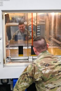 Staff Sgt. Ryan Krasnecky, 104th Fighter Wing metals technology journeyman, examines a 3D-printed ammo container, January 15, 2025, at Barnes Air National Guard Base, Westfield, Mass.