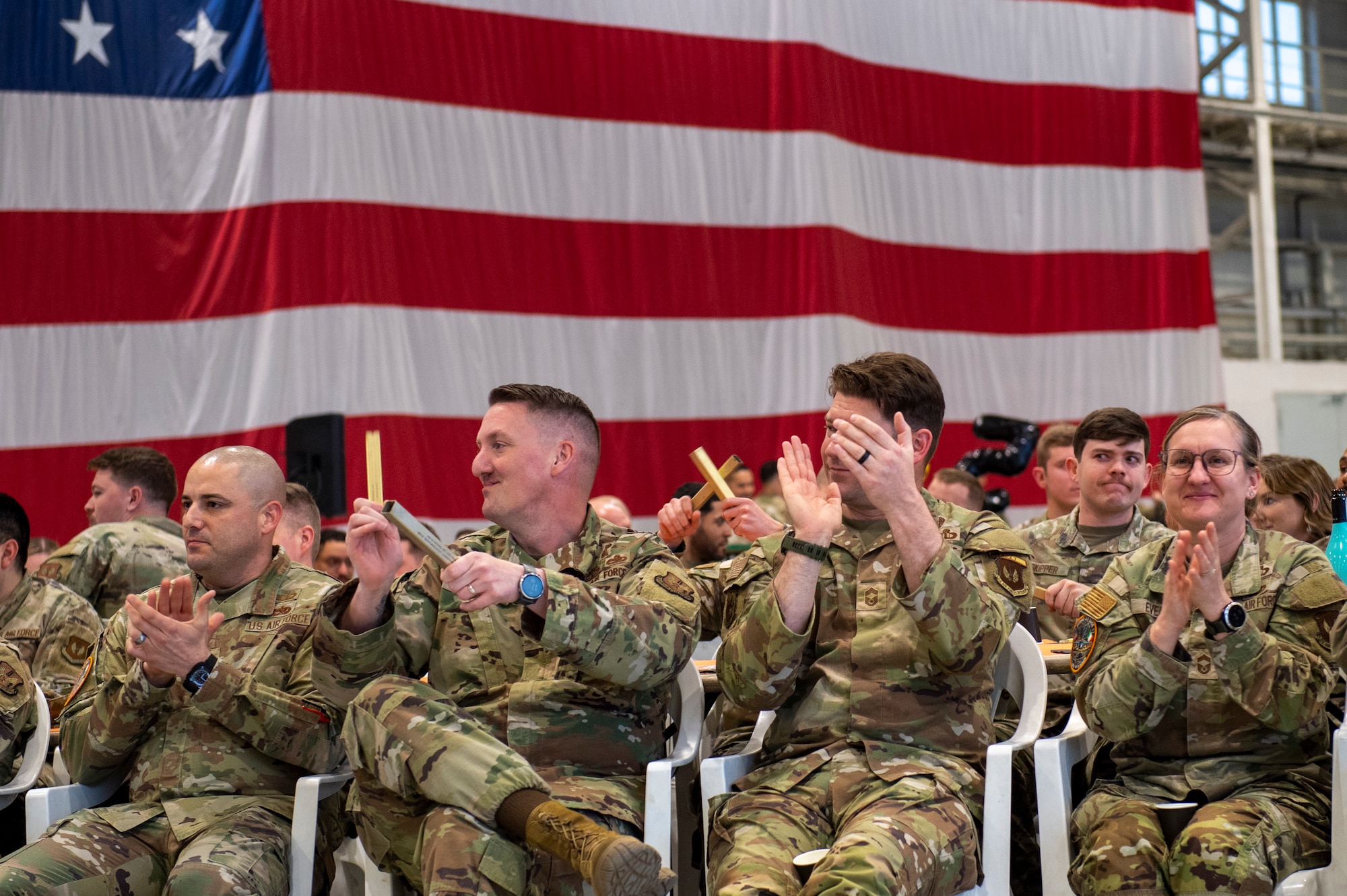 A crowd of Airmen cheering