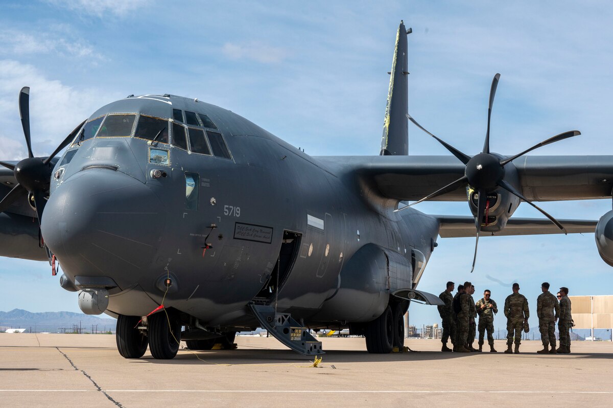 An HC-130J Combat King II aircraft sits on the flightline during a tour with the University of Wyoming U.S. Air Force Reserve Officers Training Course cadets at Davis-Monthan Air Force Base, Arizona, April 1, 2025. The AFROTC is an educational program designed to give men and women the opportunity to become an officer in the Air and Space Forces while completing a degree. (U.S. Air Force photo by Airman Samantha Melecio)