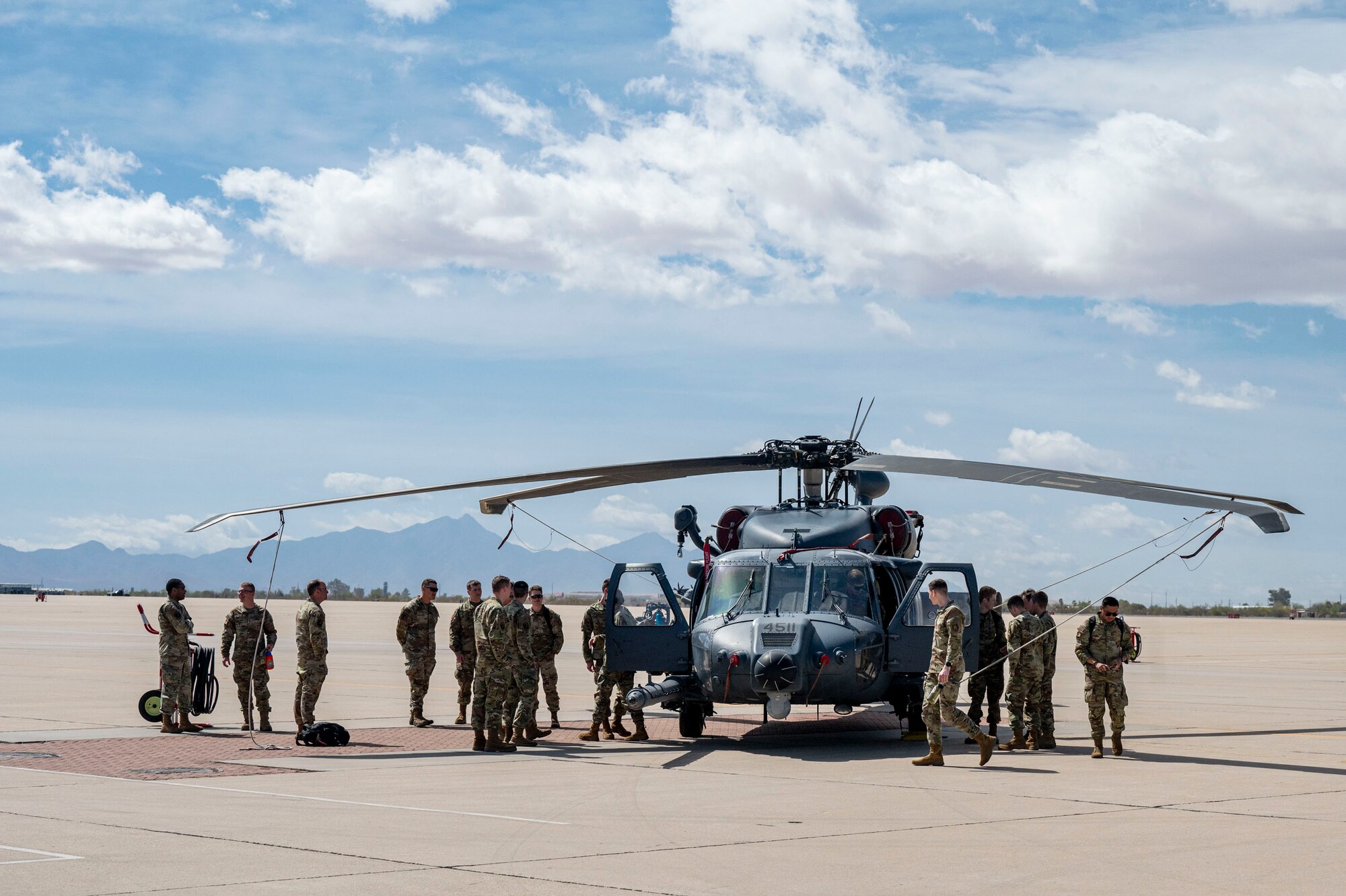 University of Wyoming U.S. Air Force Reserve Officers Training Course cadets look at an HH-60W Jolly Green II helicopter assigned to the 55th Rescue Squadron, during a tour at Davis-Monthan Air Force Base, Arizona, April 1, 2025. The AFROTC program equips aspiring officers with the necessary leadership, teamwork and decision-making skills while emphasizing the Air Force’s commitment to integrity, service and excellence. (U.S. Air Force photo by Airman Samantha Melecio)