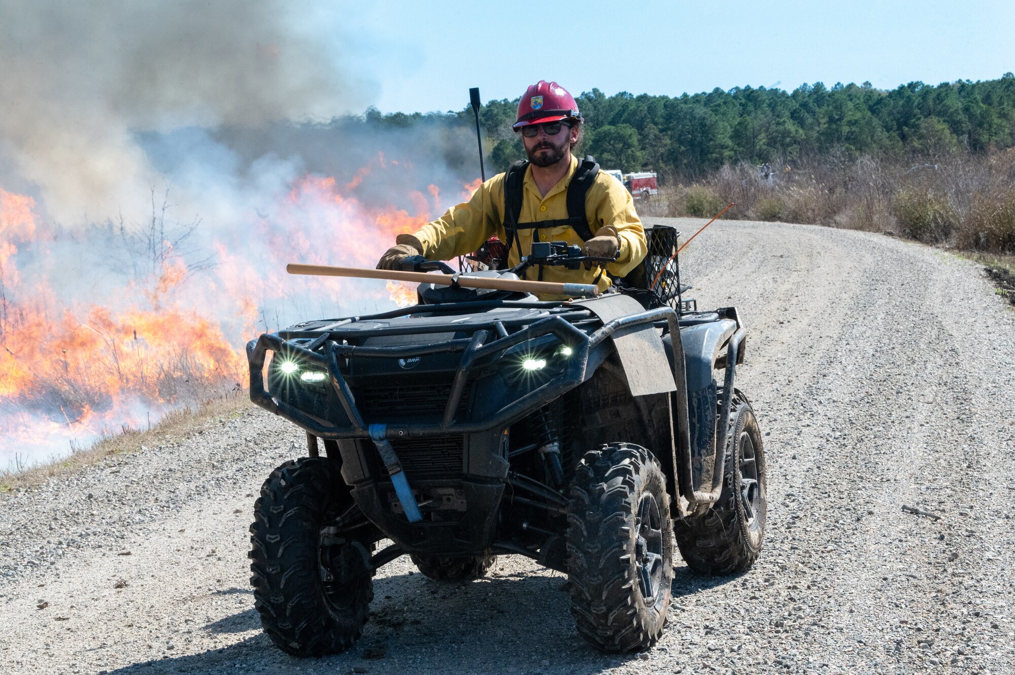 Firefighter rides ATV