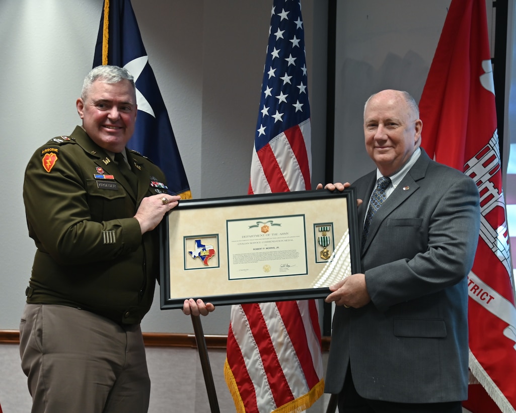 Col. Calvin Kroeger, U.S. Army Corps of Engineers' Fort Worth District commander, presents Bob Morris with the Civil Service Commendation Medal during his retirement ceremony.