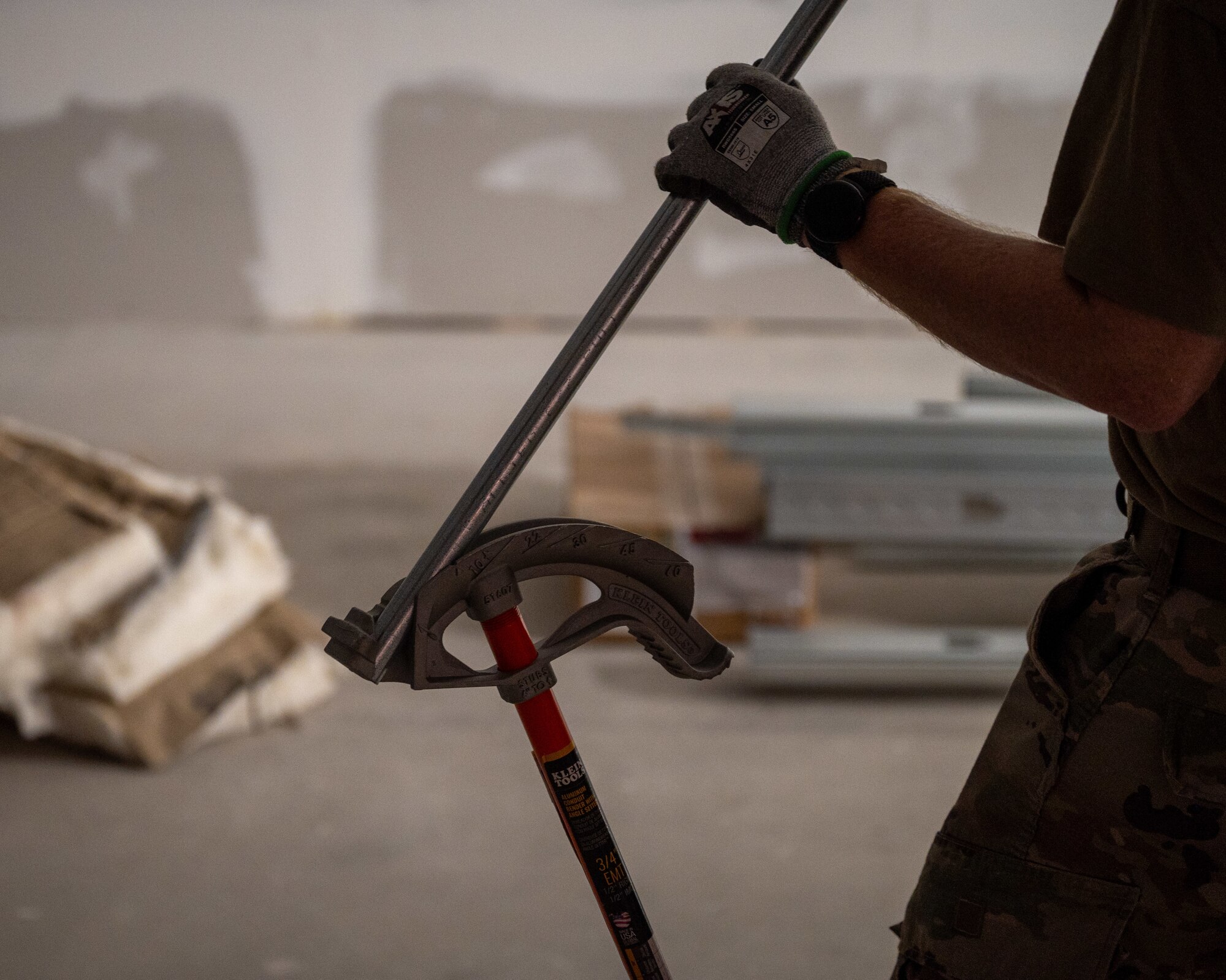 U.S Air Force Tech. Sgt. Brandon Gilmore, electrical journeyman, 445th Civil Engineer Squadron, bends a pipe during a deployment for training at Patrick Space Force Base, Florida, March 5, 2025. The deployment for training included Airman from the 445th CES from Wright-Patterson Air Force Base remodeling a joint warehouse space on PSFB to convert it into office space for the Requirements and Optimization office of the 45th Civil Engineer Squadron. (U.S. Space Force photo by Senior Airman Spencer Contreras)