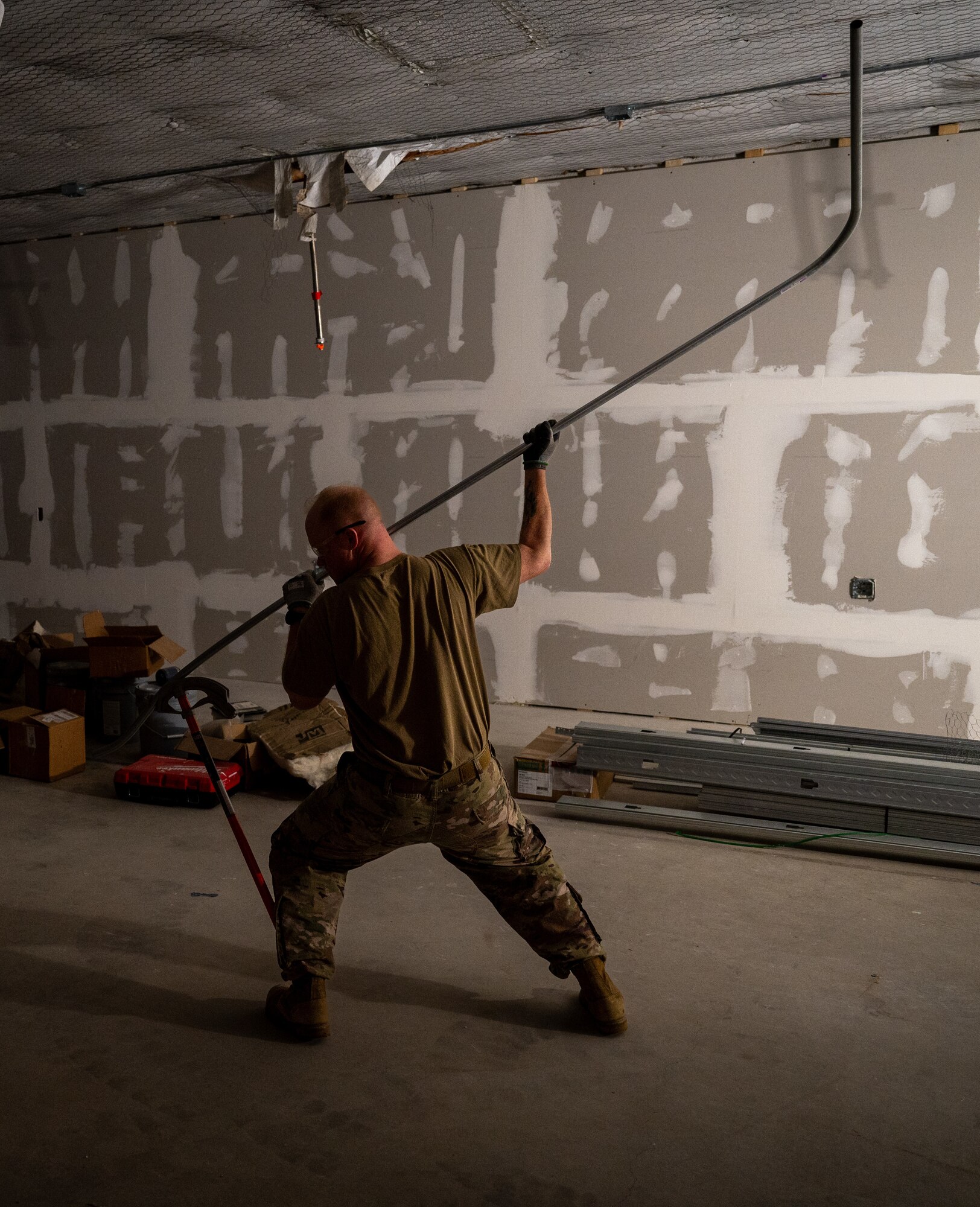 U.S Air Force Tech. Sgt. Brandon Gilmore, electrical journeyman, 445th Civil Engineer Squadron, bends a pipe during a deployment for training at Patrick Space Force Base, Florida, March 5, 2025. The deployment for training included Airman from the 445th CES from Wright-Patterson Air Force Base remodeling a joint warehouse space on PSFB to convert it into office space for the Requirements and Optimization office of the 45th Civil Engineer Squadron. (U.S. Space Force photo by Senior Airman Spencer Contreras)