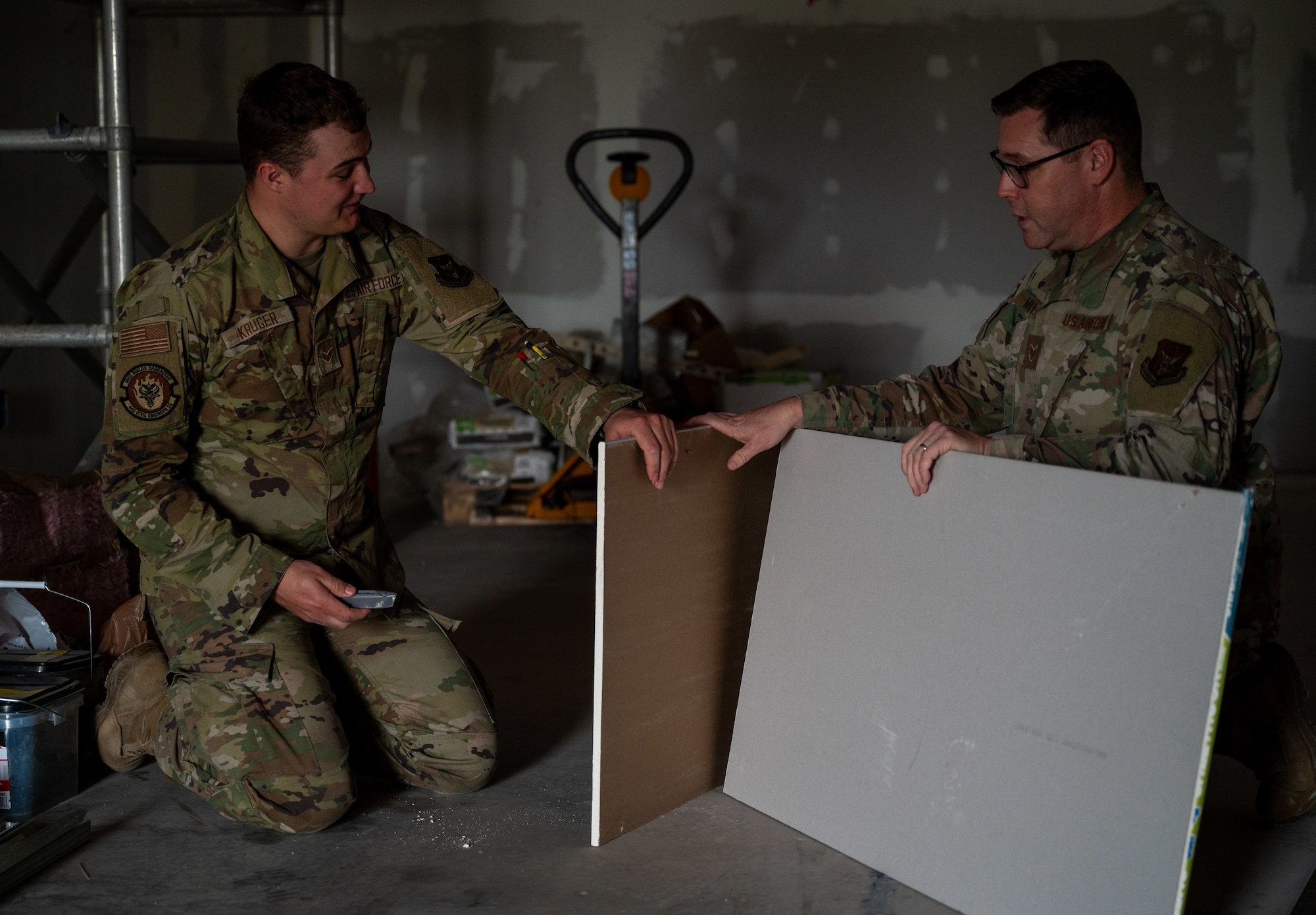 U.S. Air Force Staff Sgt. Ben Maxfield, structural journeyman, 445th Civil Engineer Squadron, right, and U.S. Air Force Senior Airman Kevin Kruger, structural journeyman, 445th Civil Engineer Squadron, cut drywall during a deployment for training at Patrick Space Force Base, Florida, March 5, 2025.