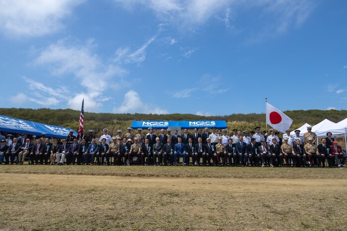 The Honorable Peter Hegseth, United States Secretary of Defense; ISHIBA Shigeru, prime minster of Japan; the Commandant of the Marine Corps Gen. Eric Smith; and other U.S. and Japan government officials and military and self-defense force leadership pose for a group photo following the conclusion of the 80th Reunion of Honor ceremony at Iwo To, Japan, March 29, 2025. The 80th Reunion of Honor is a milestone anniversary that commemorates the sacrifices made by both Japanese and American service members during the Battle of Iwo Jima, honoring their legacy and ensuring their stories are preserved for future generations. This milestone anniversary serves as a reminder of the enduring partnership between both nations and the progress made toward regional stability over the past 80 years. (U.S. Marine Corps photo by Gunnery Sgt. Jonathan Wright)